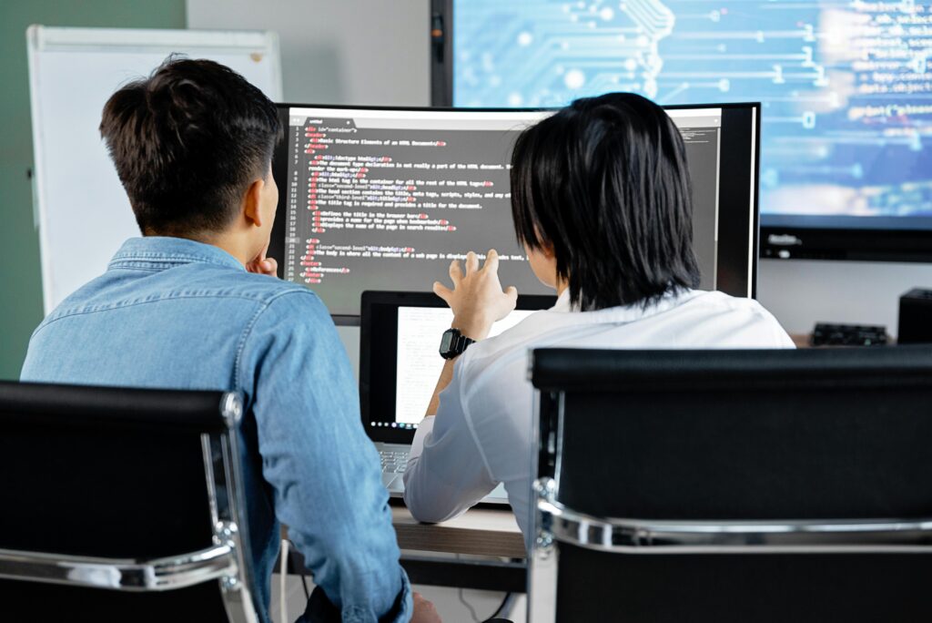 programmers cooperating on writing code